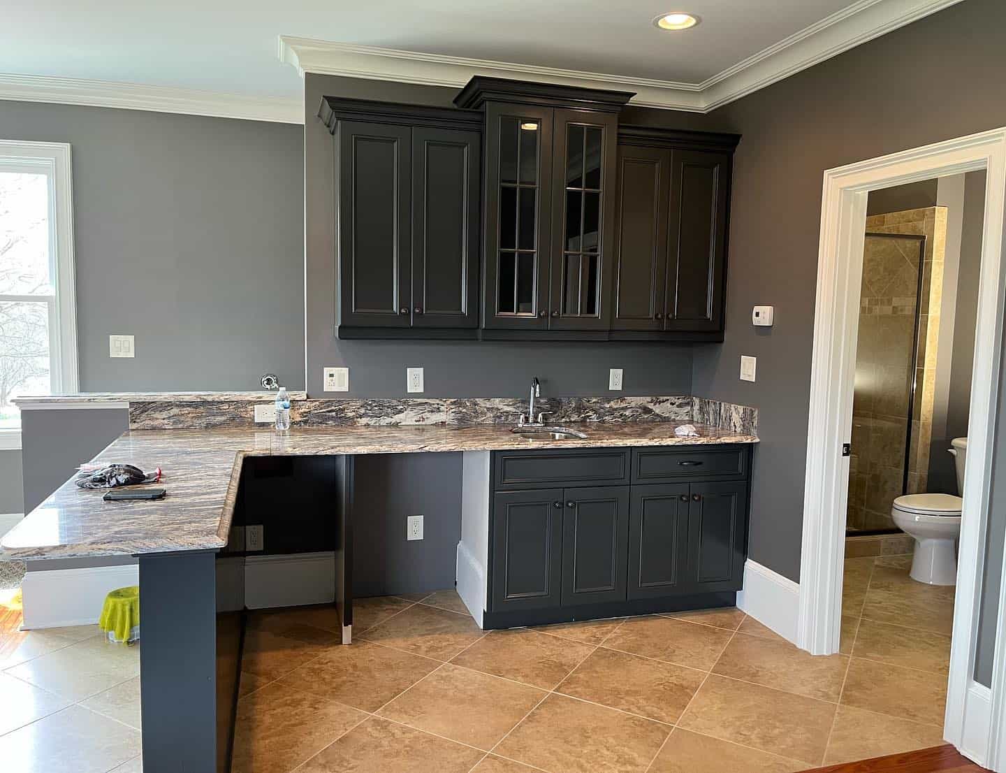 Freshly painted walls create a cozy ambiance in Apex, NC homes- colored kitchen cabinets